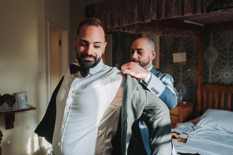 Bride and groom sharing a candid moment during ceremony in Reading Berkshire